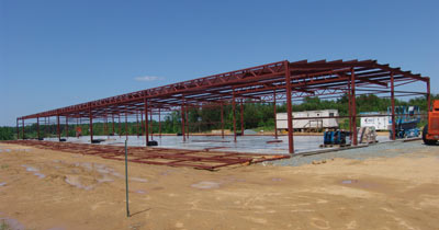 two Erect-a-Tube buildings that containing 8 nested T-Hangars each - Rockingham County Airport