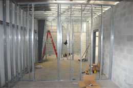 Inside of shipping office looking towards bathrooms at far end.